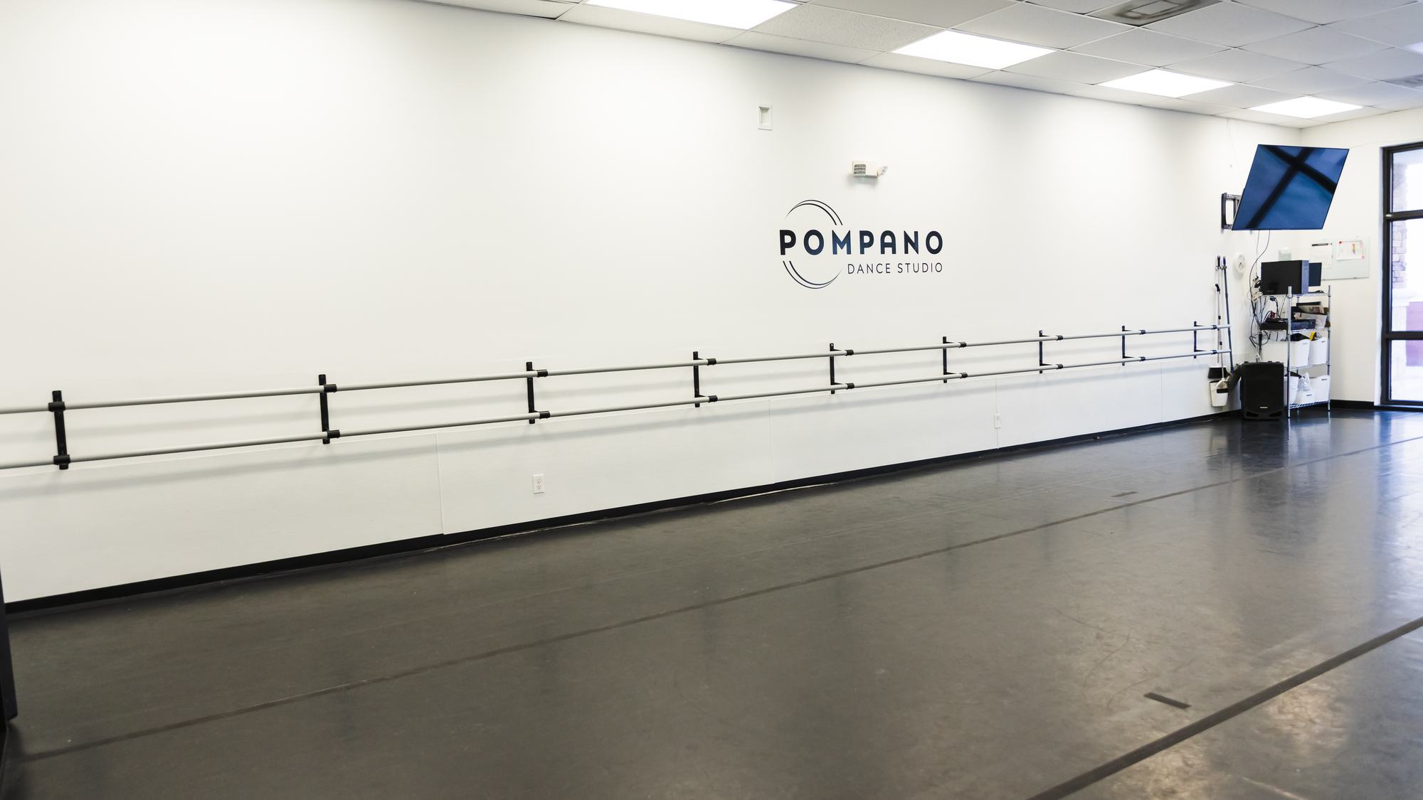 A Pompano Dance Studio room, with barres along the mirrored wall